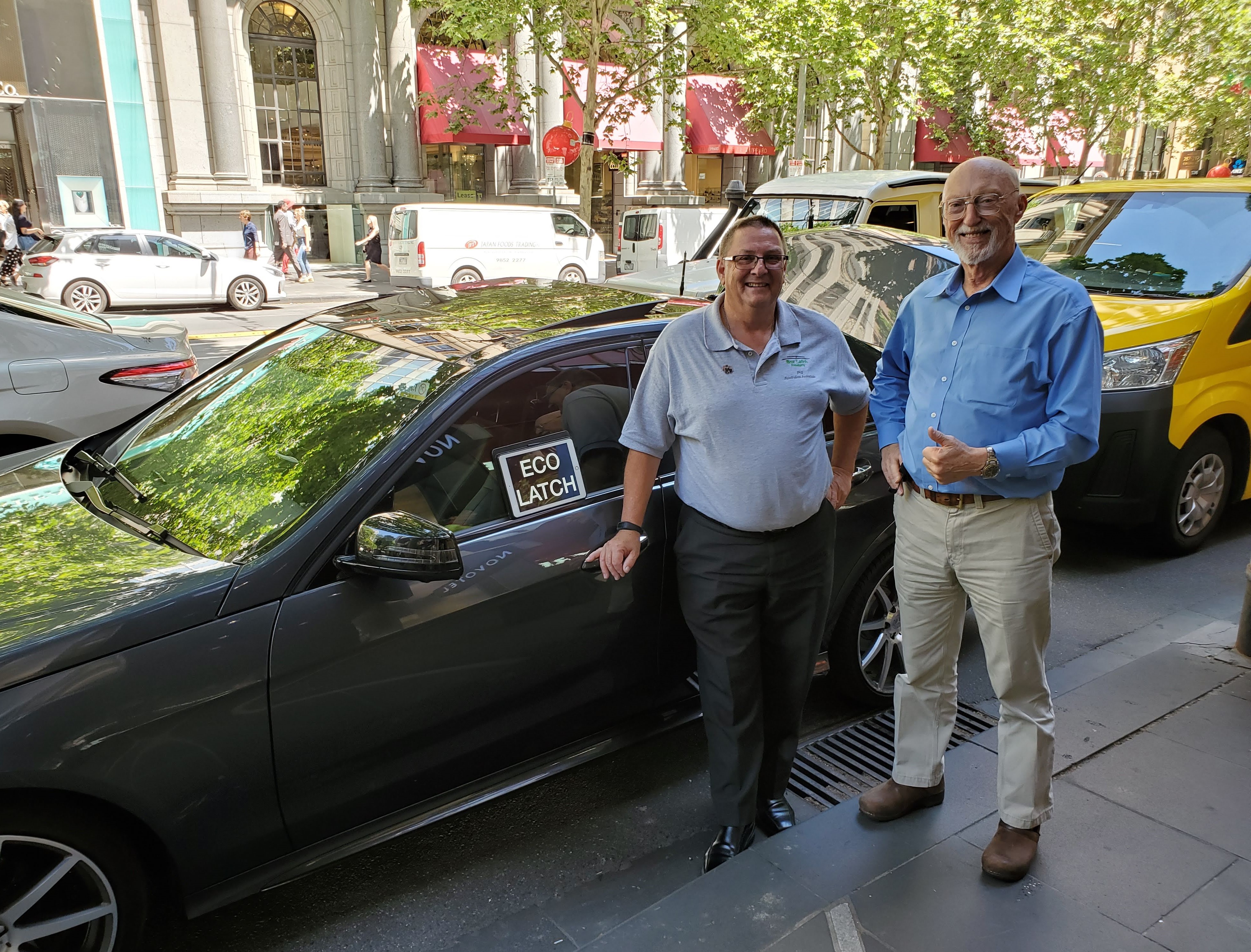 Box Latch - Jack Wilson, CEO and Phil Southam Box Latch Products Australian Associate, standing outside by a car.
