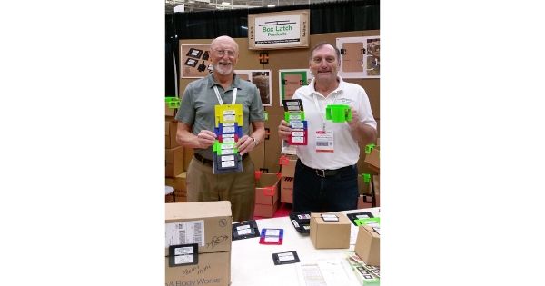Box Latch - Jim and Jack Wilson holding products in a trade show booth