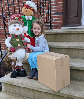 Box Latch - Girl on steps with stuffed snow man and corrugate box
